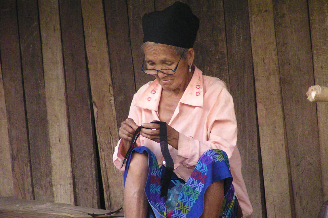 Woman weaving in village